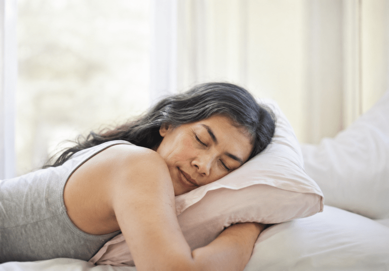 Middle-aged woman sleeping peacefully as a result of therapy for sleep without medication