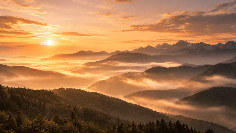 Mountain sunrise above a sea of clouds representing anxiety-related chronic insomnia, emotional recovery, and the return of restorative sleep